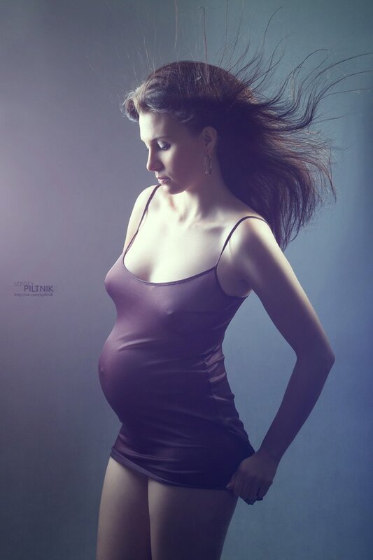 pregnant woman in purple dress
