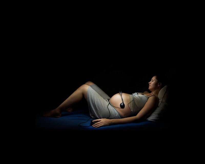 Pregnant woman listening to music