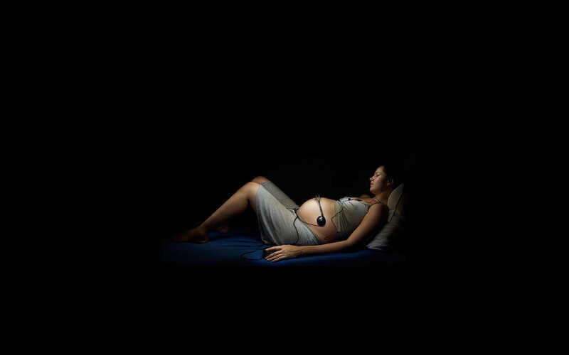 Pregnant Woman Lying Down — Black, Serene, Night