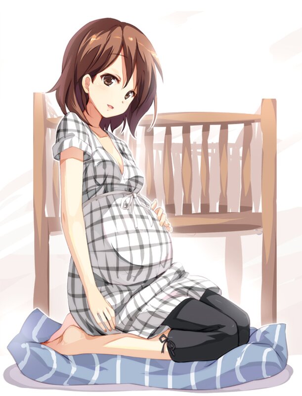 pregnant woman sitting on cushion