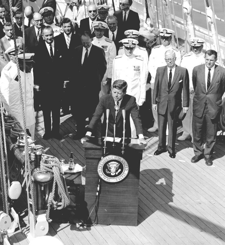 President Kennedy at podium on ship
