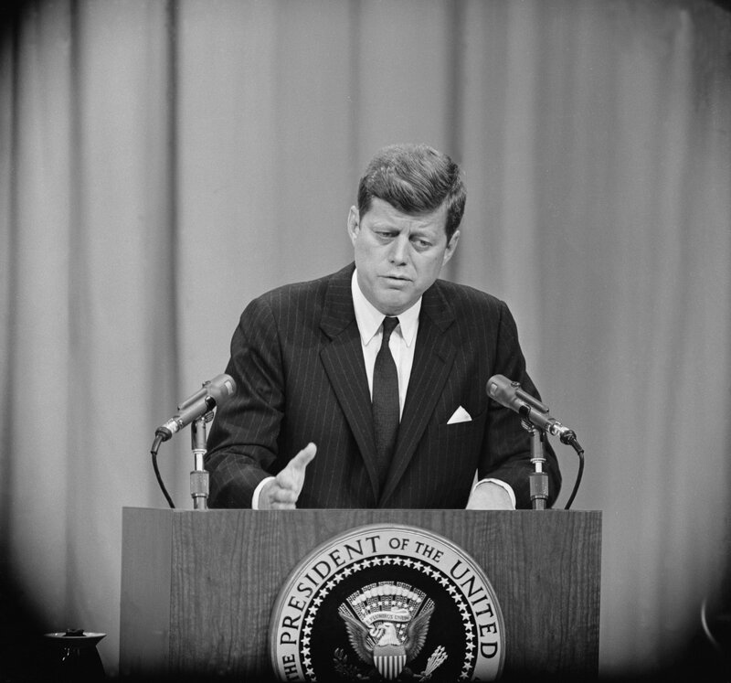President Kennedy speaking at podium