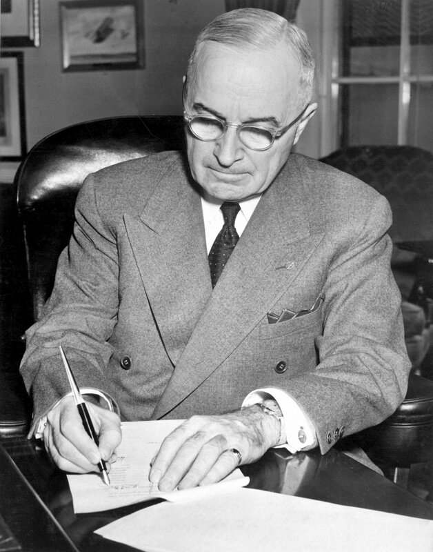 President signing document