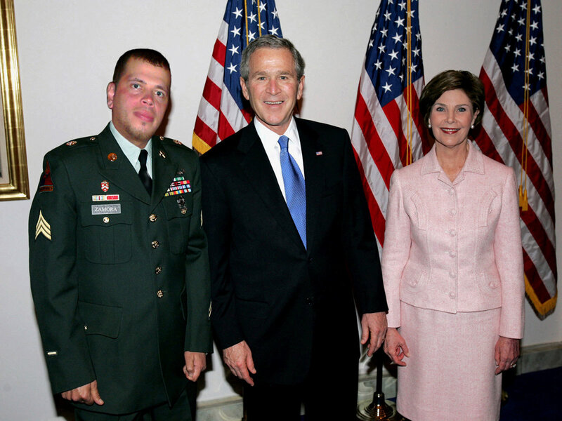 President with soldier and first lady