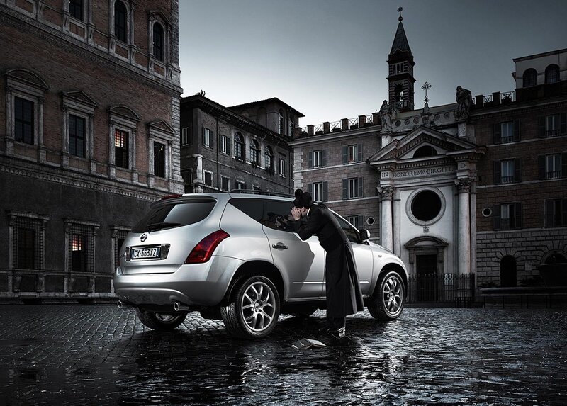 Priest by a silver car