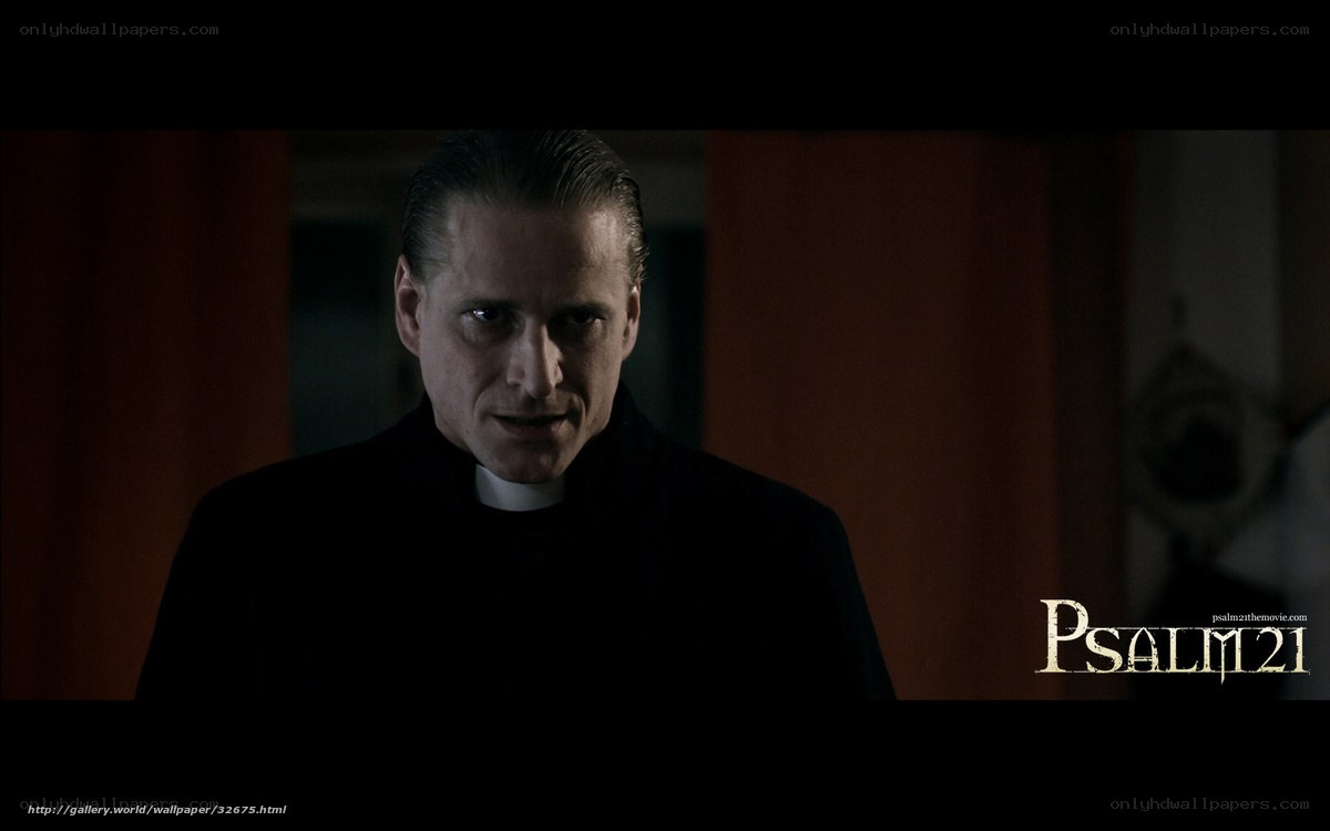 Priest in dark room