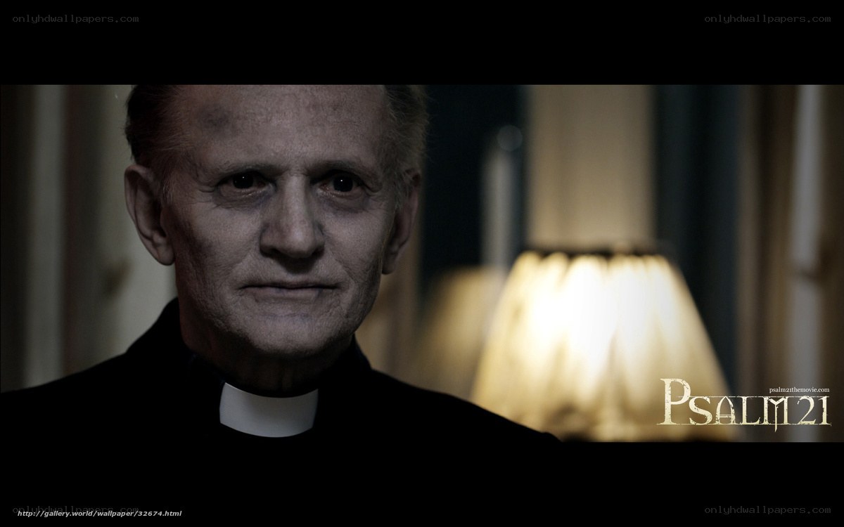 Priest in dimly lit room
