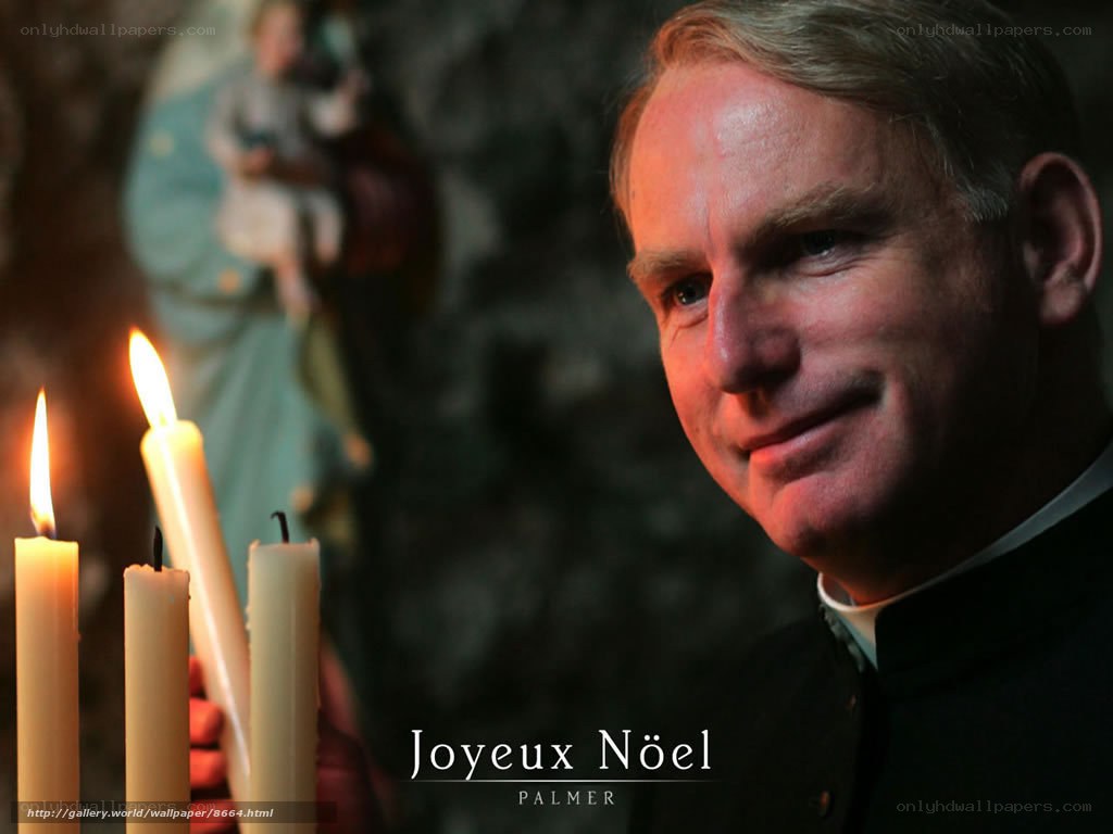 Priest with candles at night