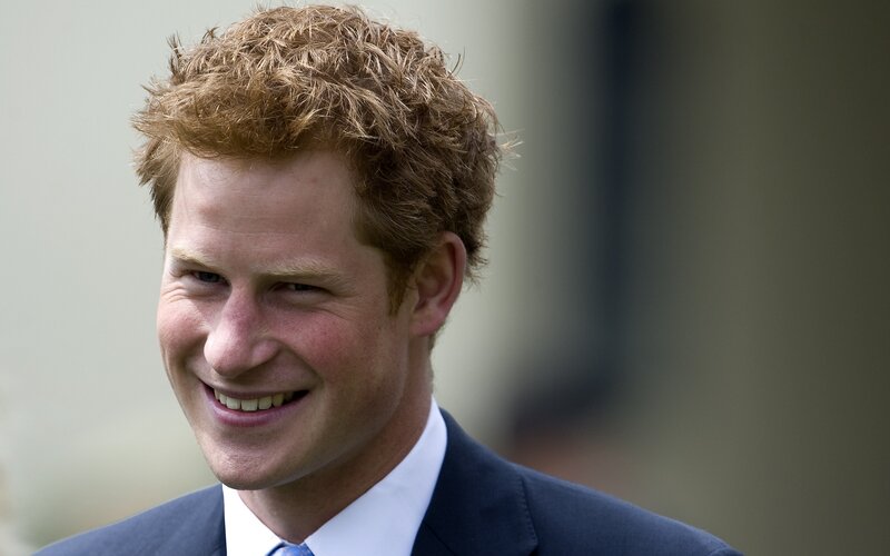 Prince Harry smiling in suit