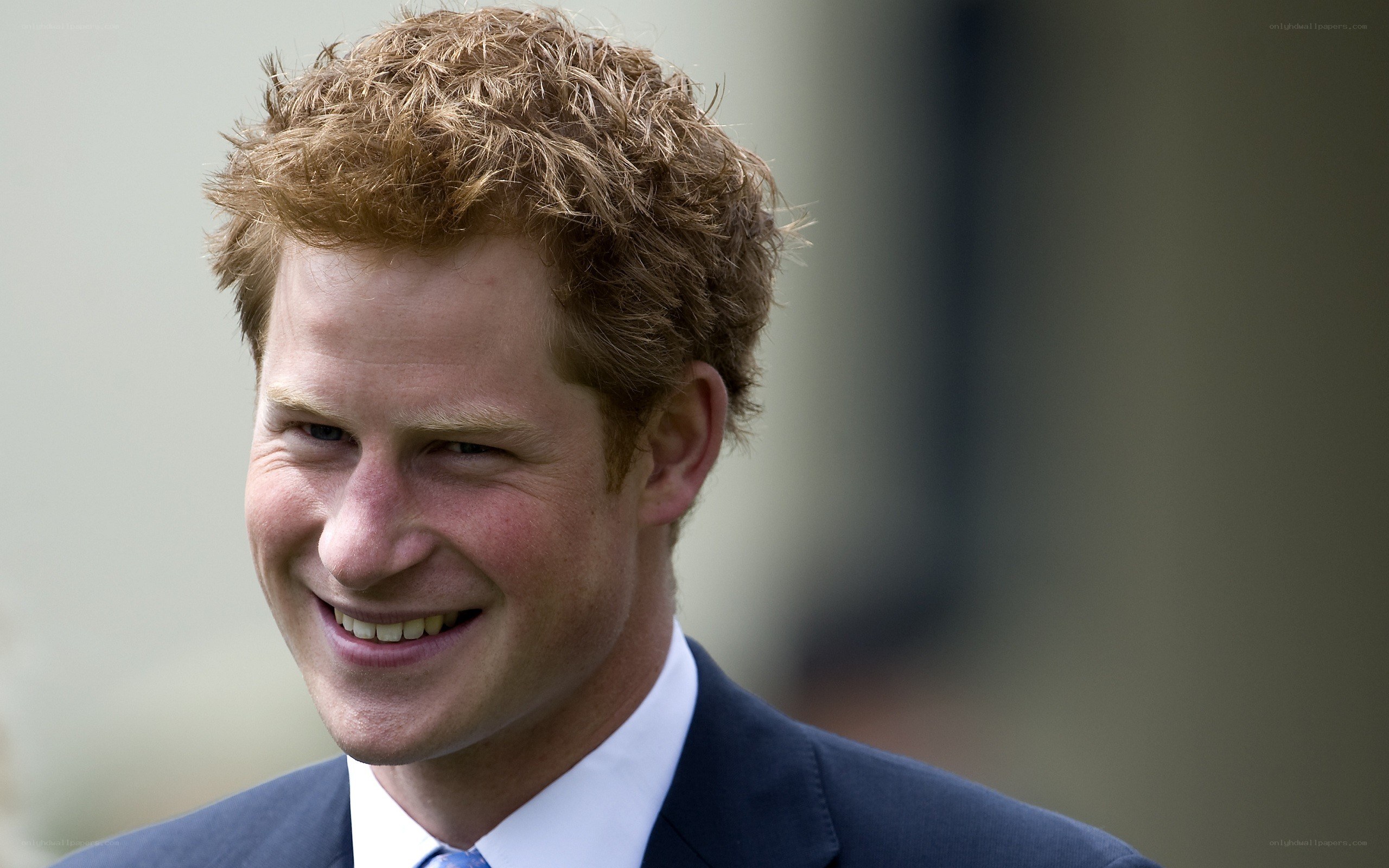 Prince Harry smiling in suit