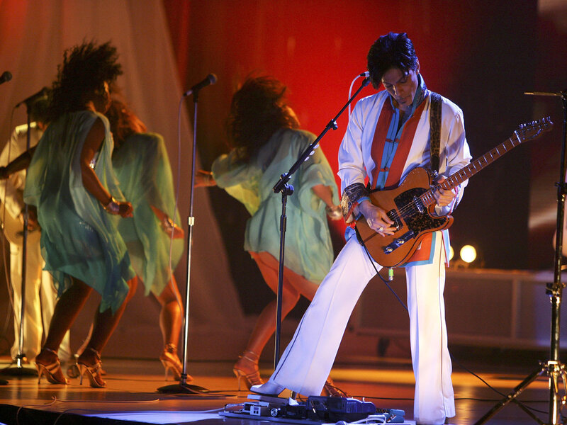 Prince performing on stage