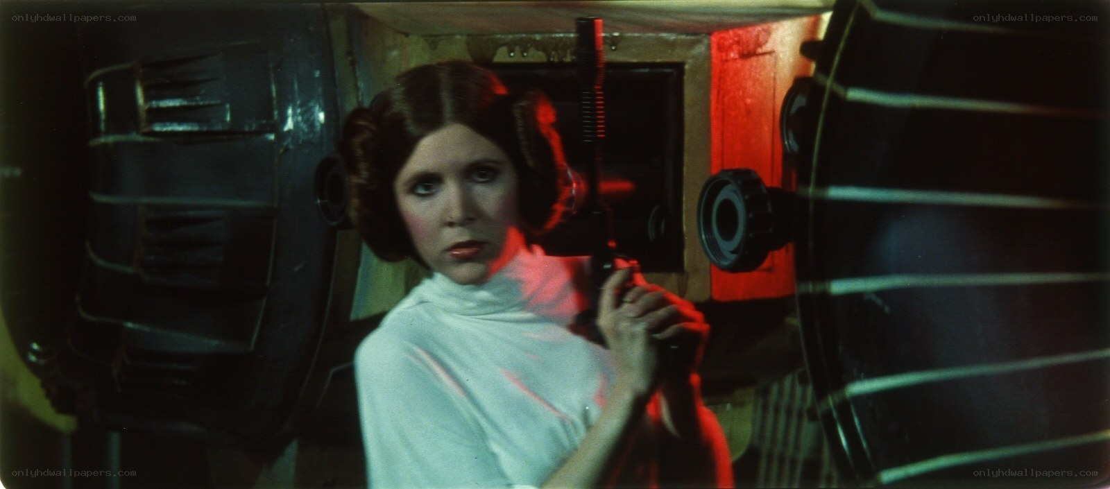 Princess Leia holding a blaster
