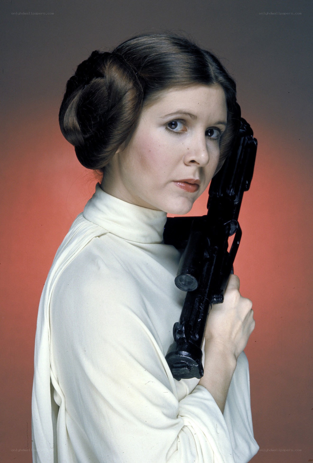 Princess Leia holding a blaster