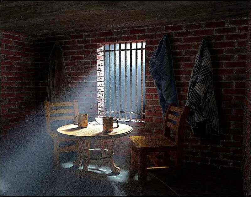 prison cell with table and chairs