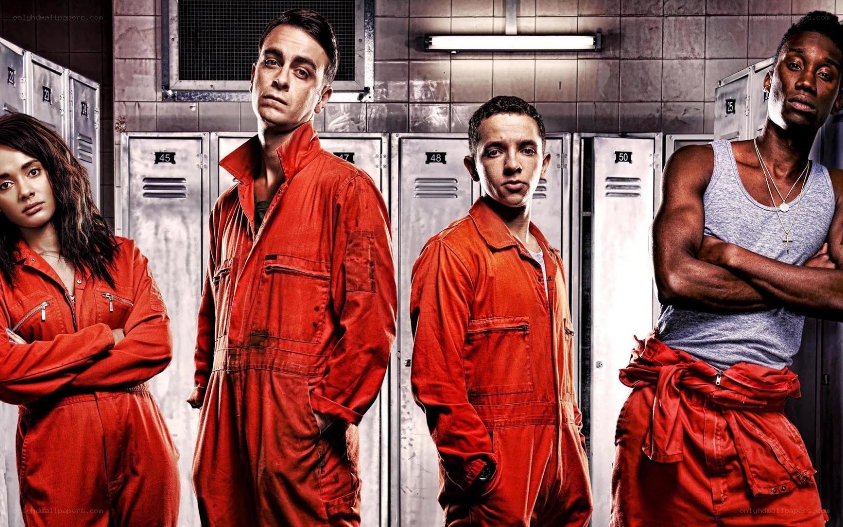 prison inmates in orange jumpsuits