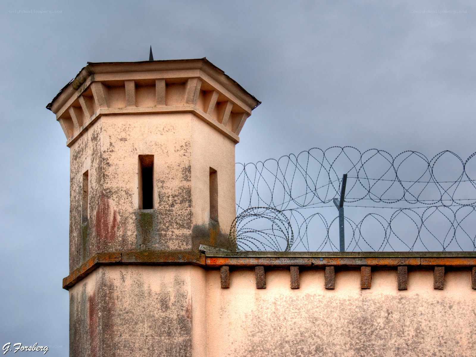 Prison tower with barbed wire