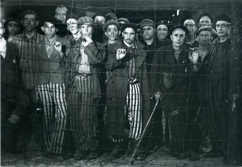 Prisoners behind barbed wire