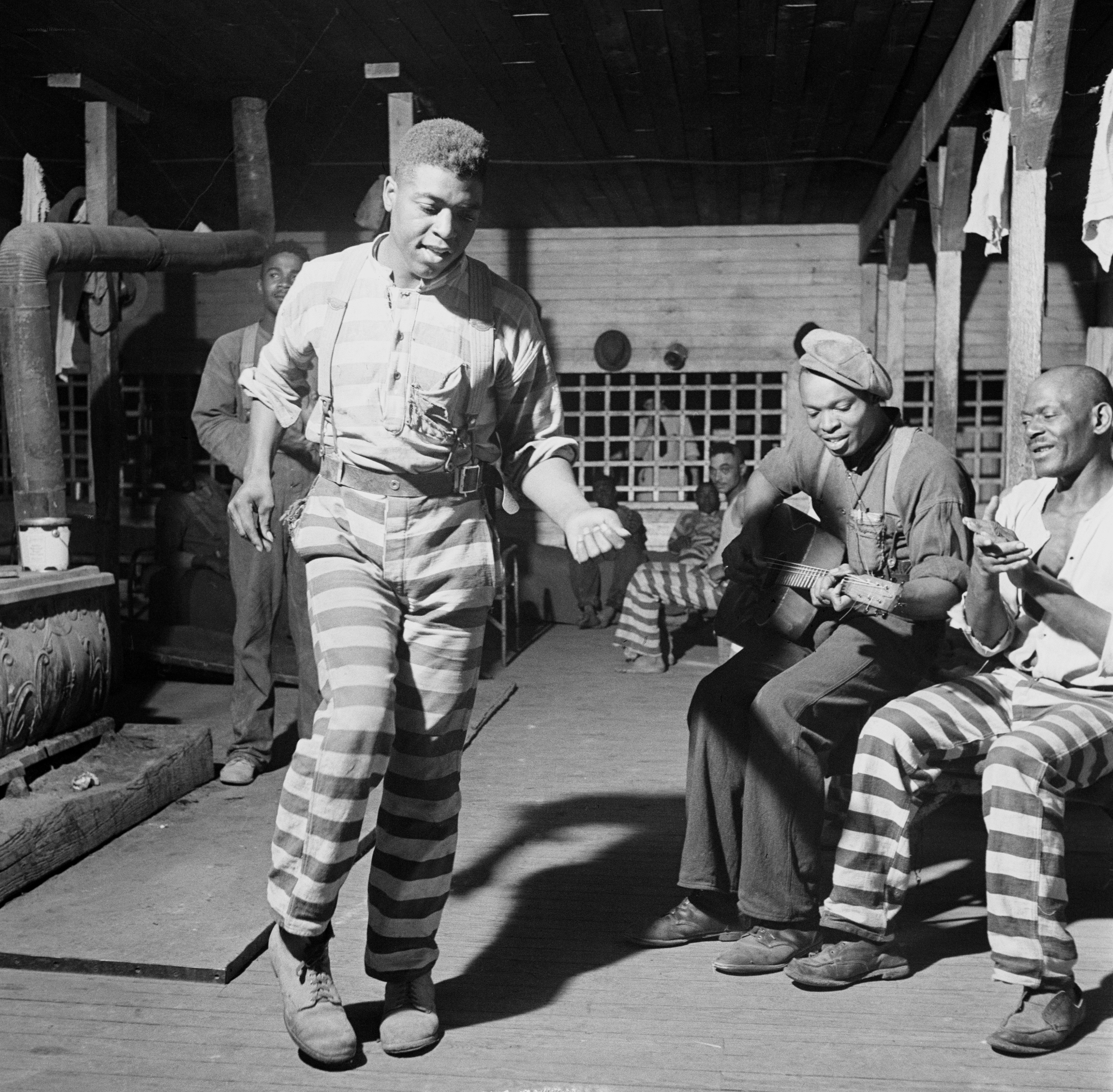Prisoners dancing and playing music