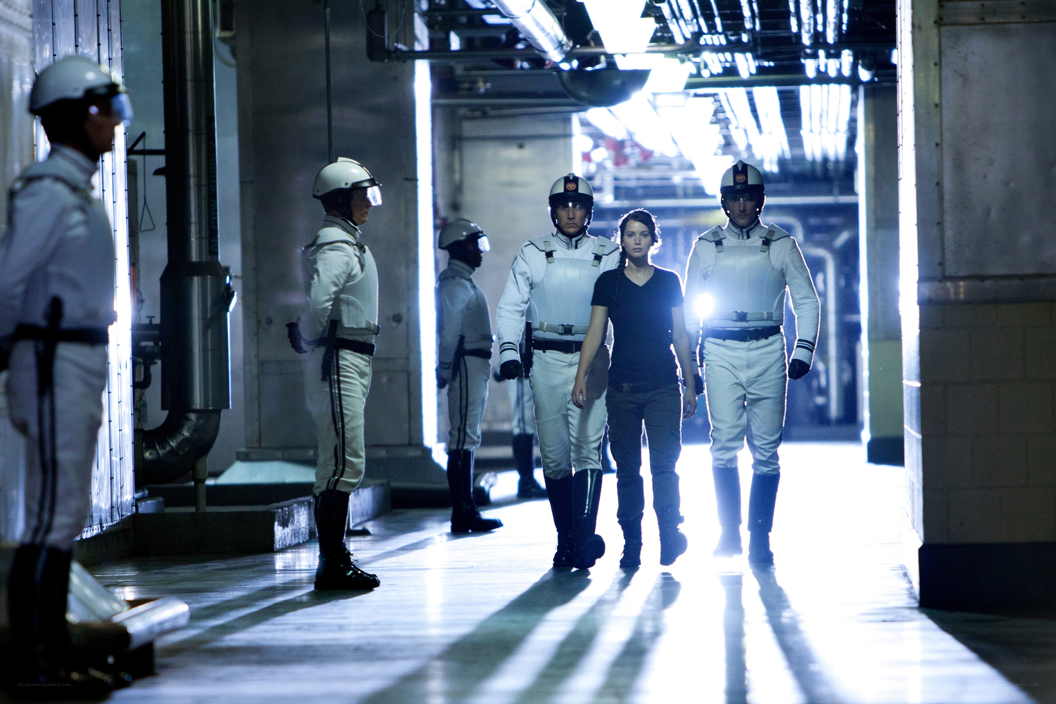 Prisoners in a futuristic corridor