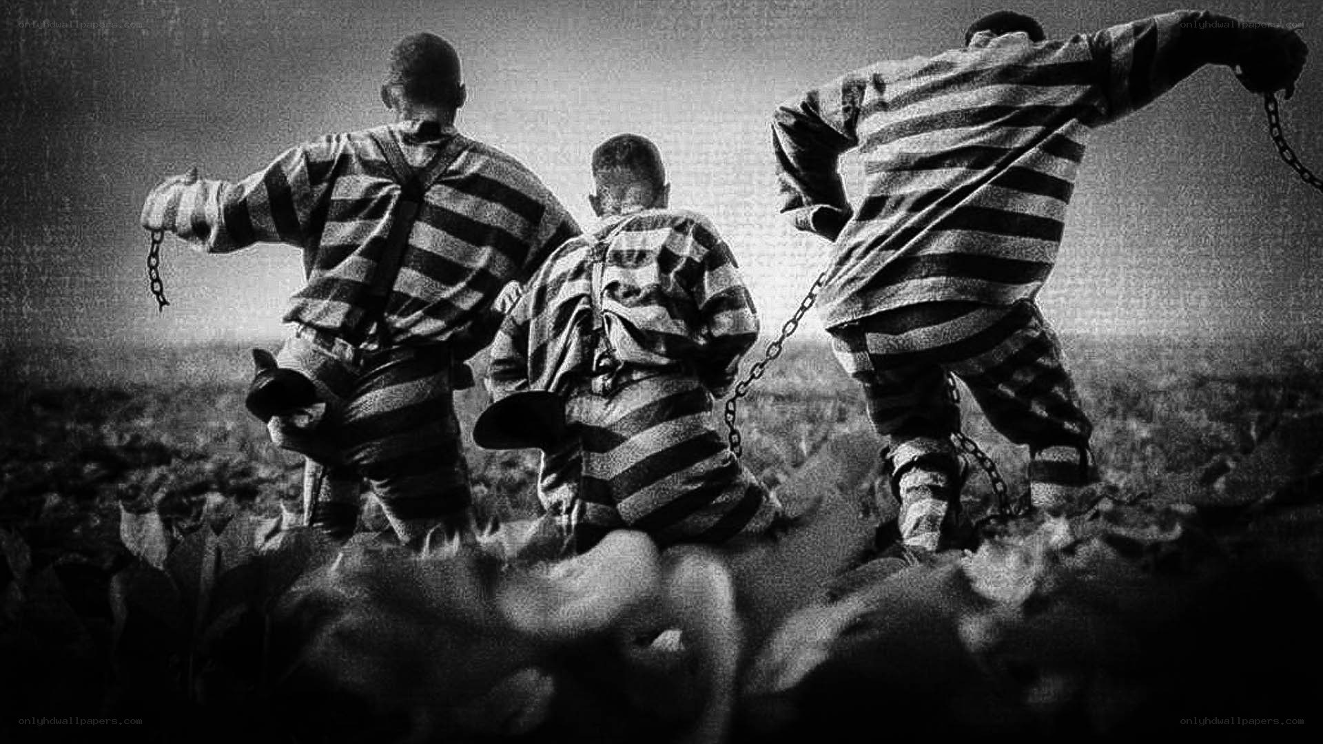 prisoners in striped uniforms
