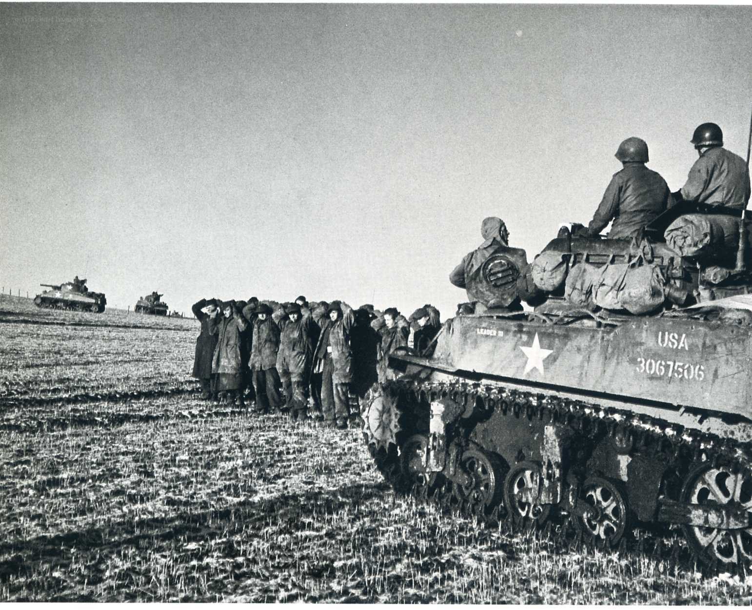 Prisoners with American tanks