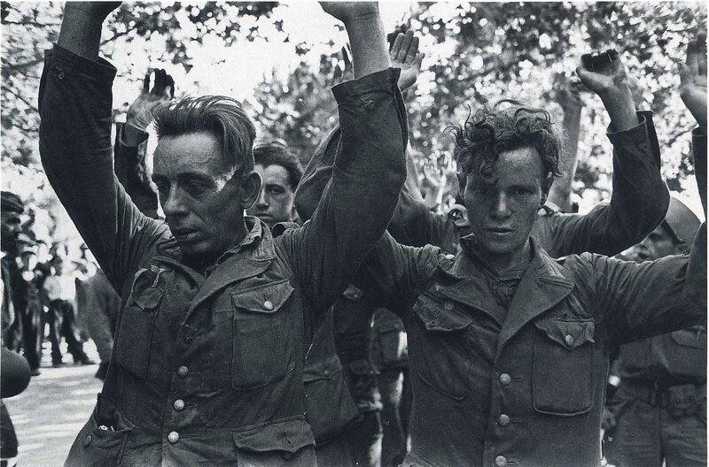 Prisoners with raised arms