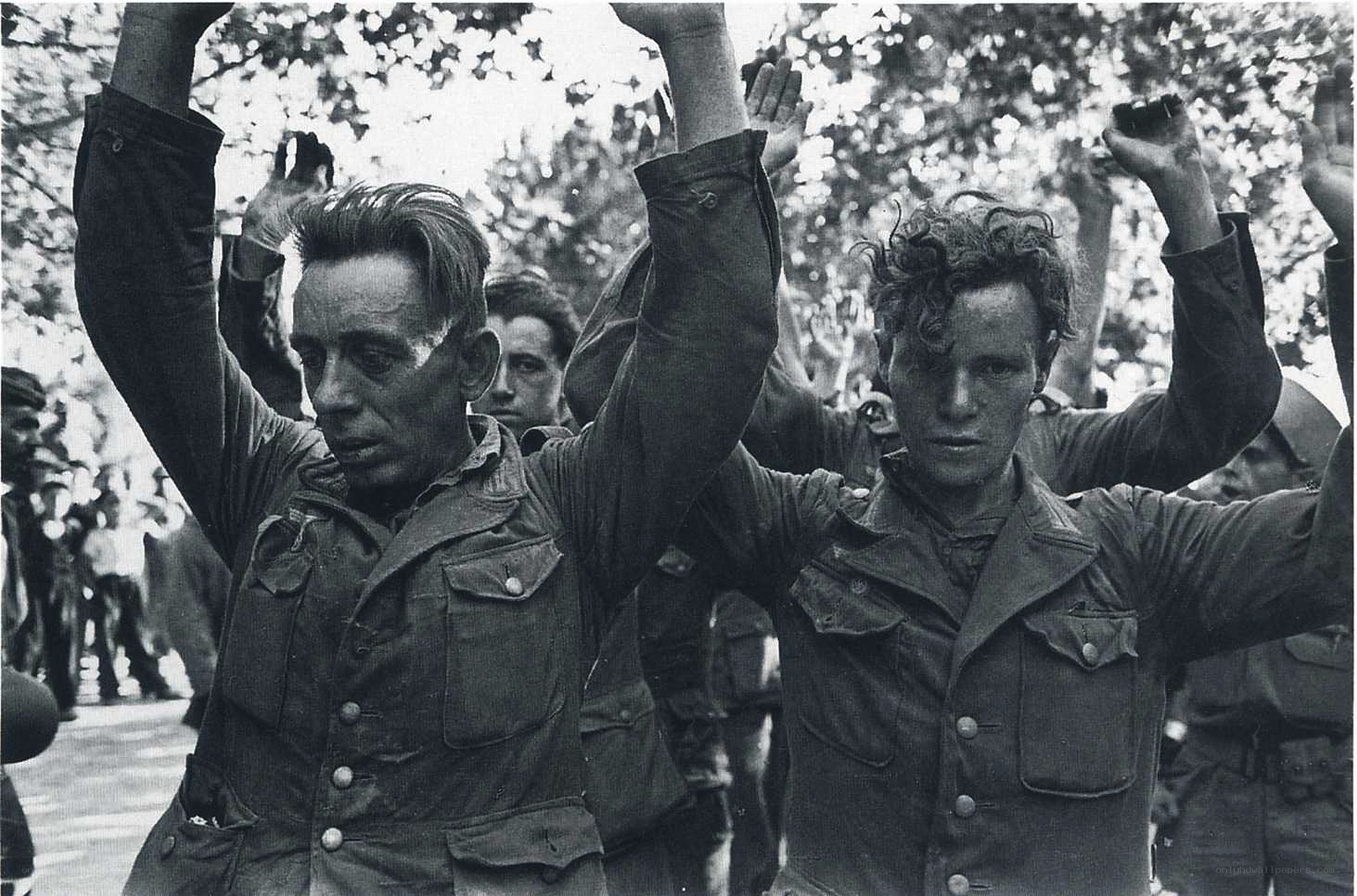 Prisoners with raised arms