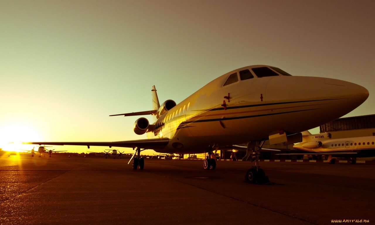 private jet at sunset