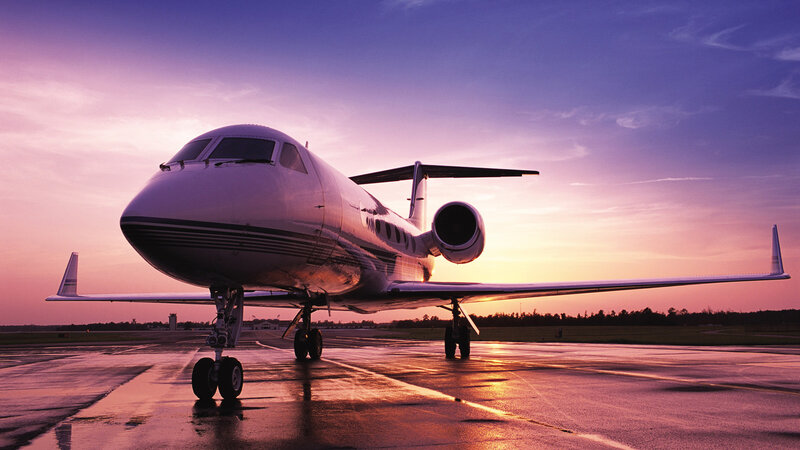 Private jet at sunset on tarmac