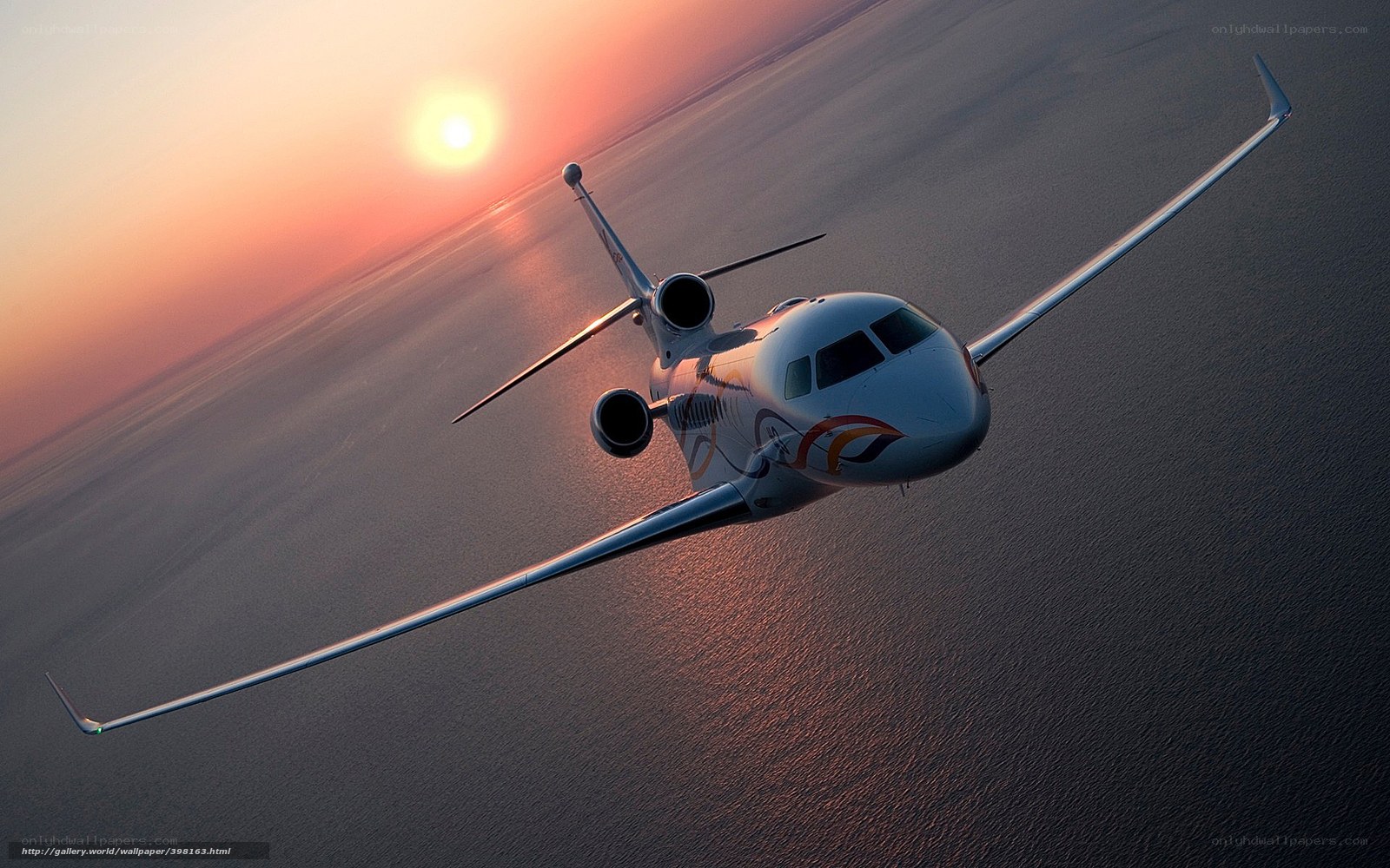 private jet at sunset over ocean