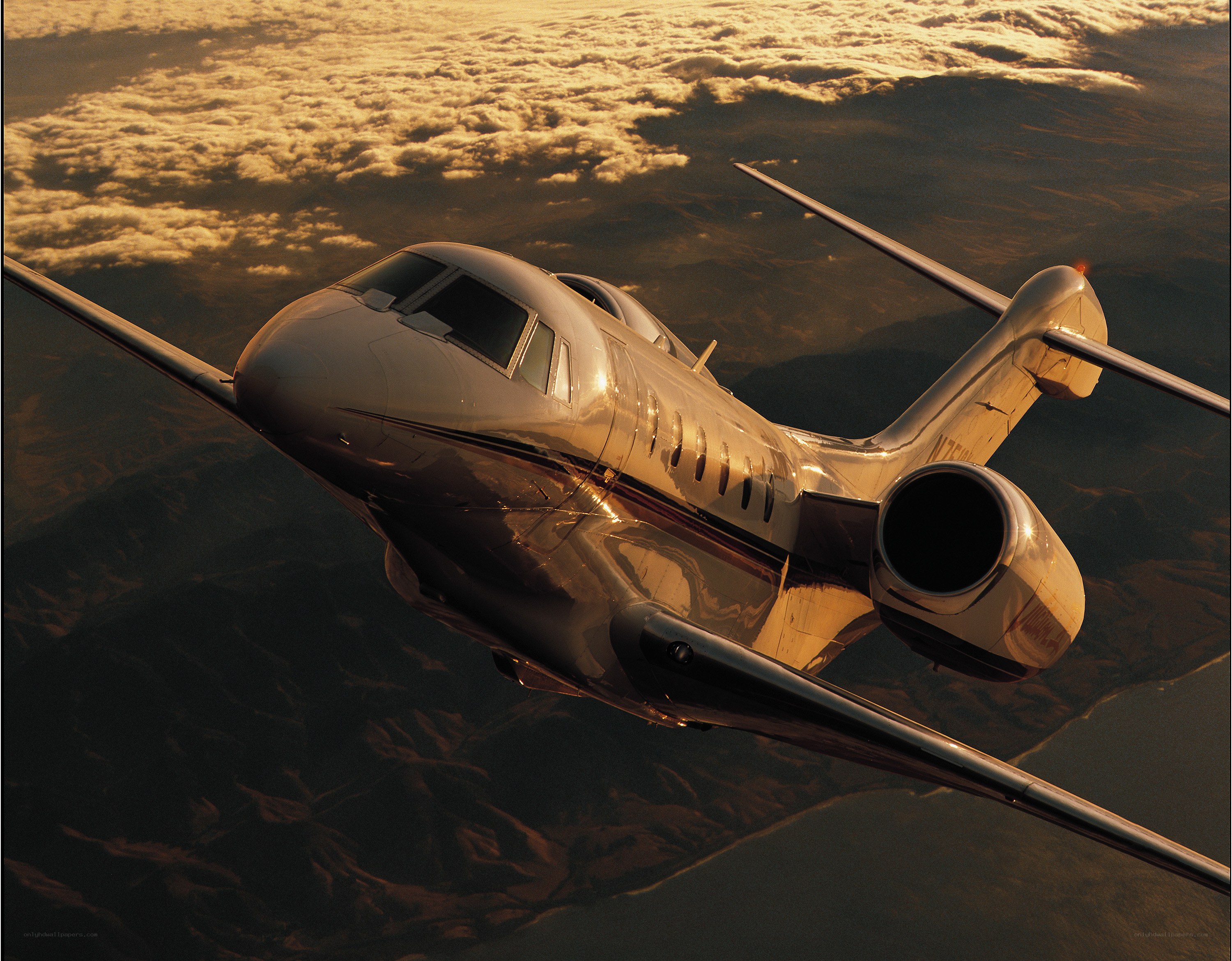 private jet flying above clouds