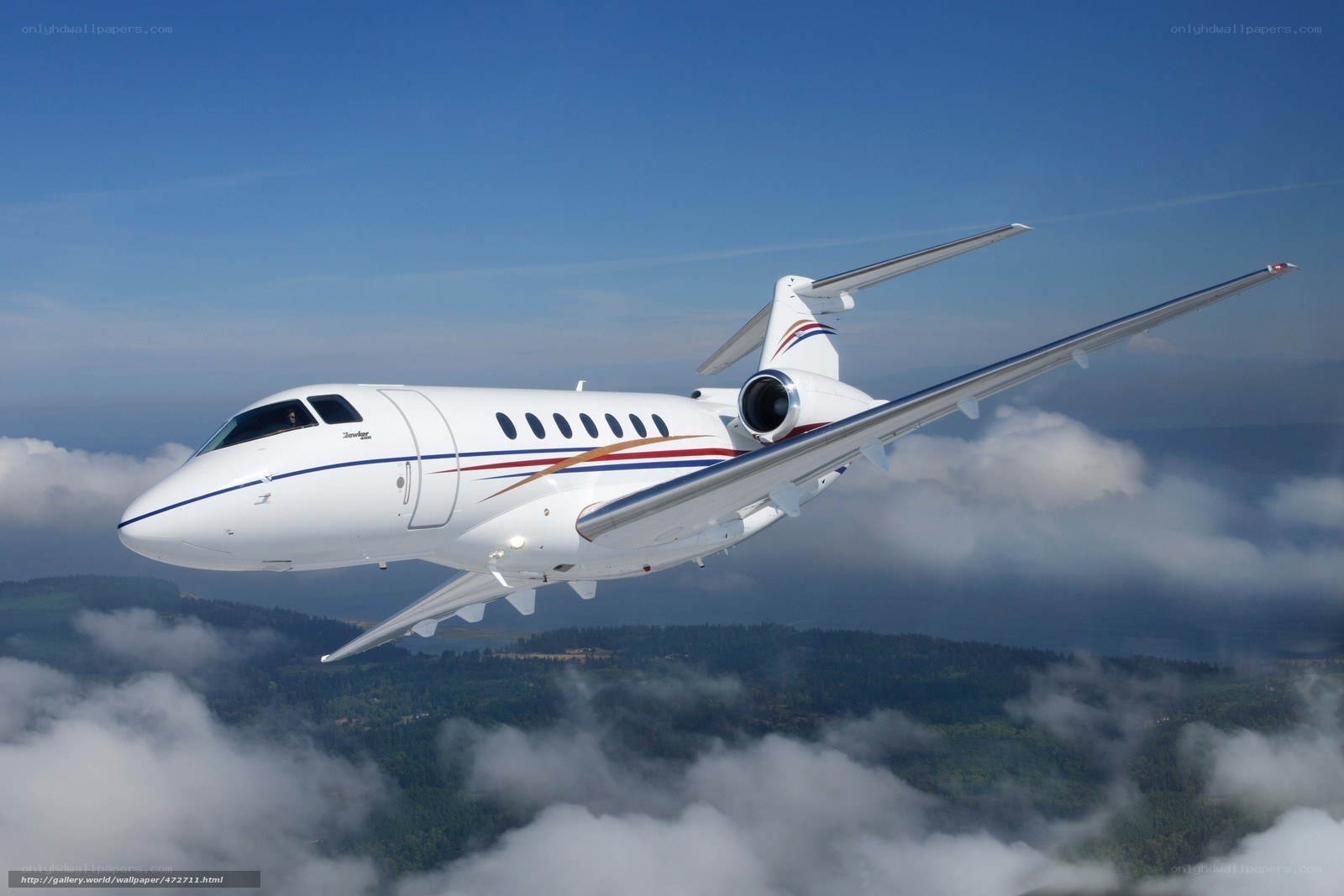 private jet flying above clouds