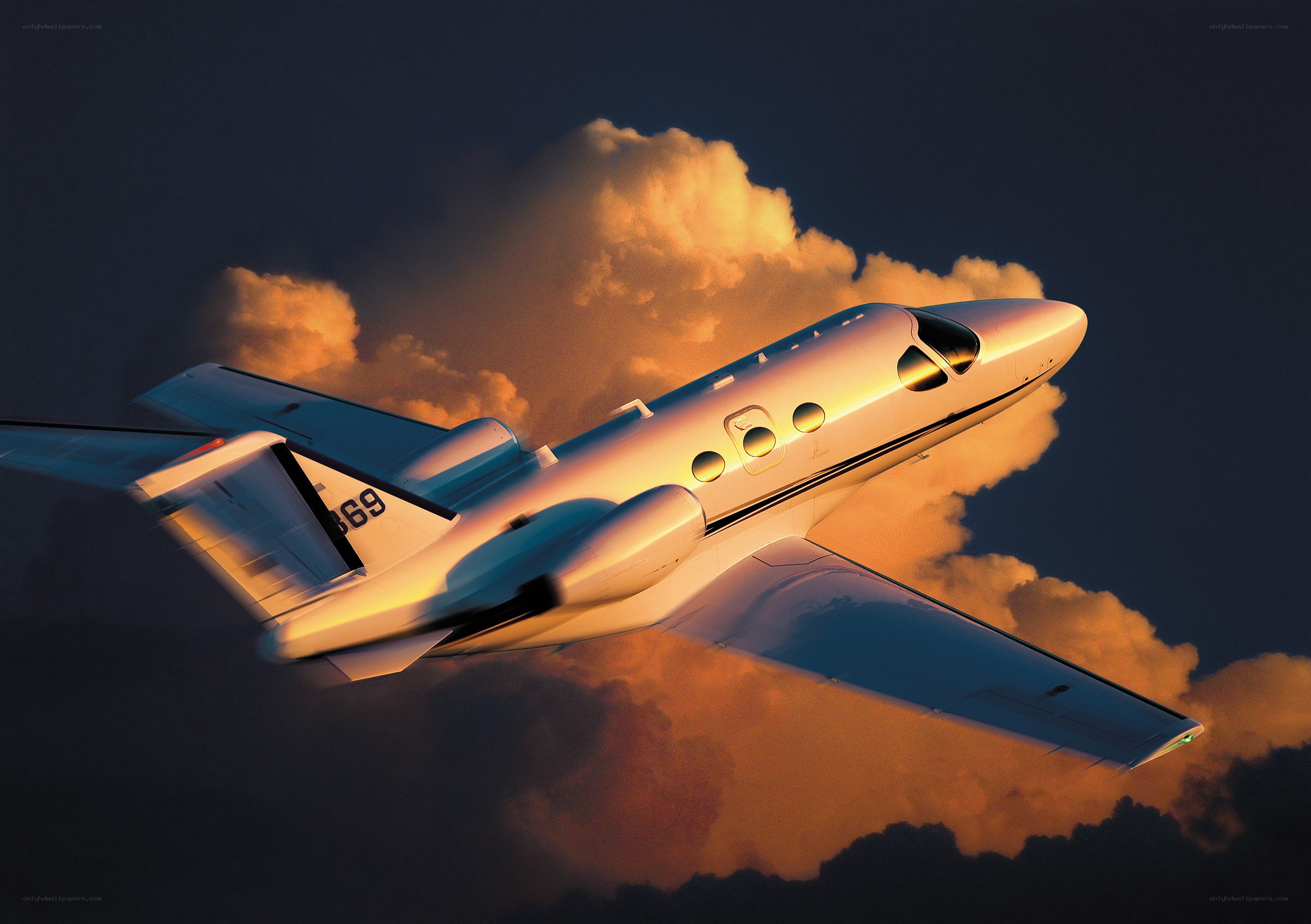 Private jet flying at sunset