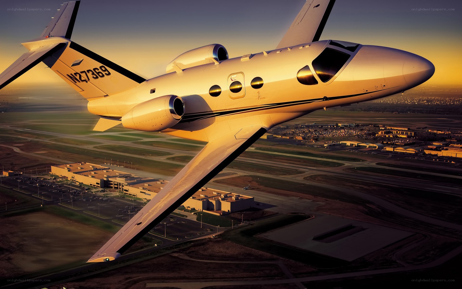 private jet flying over airport