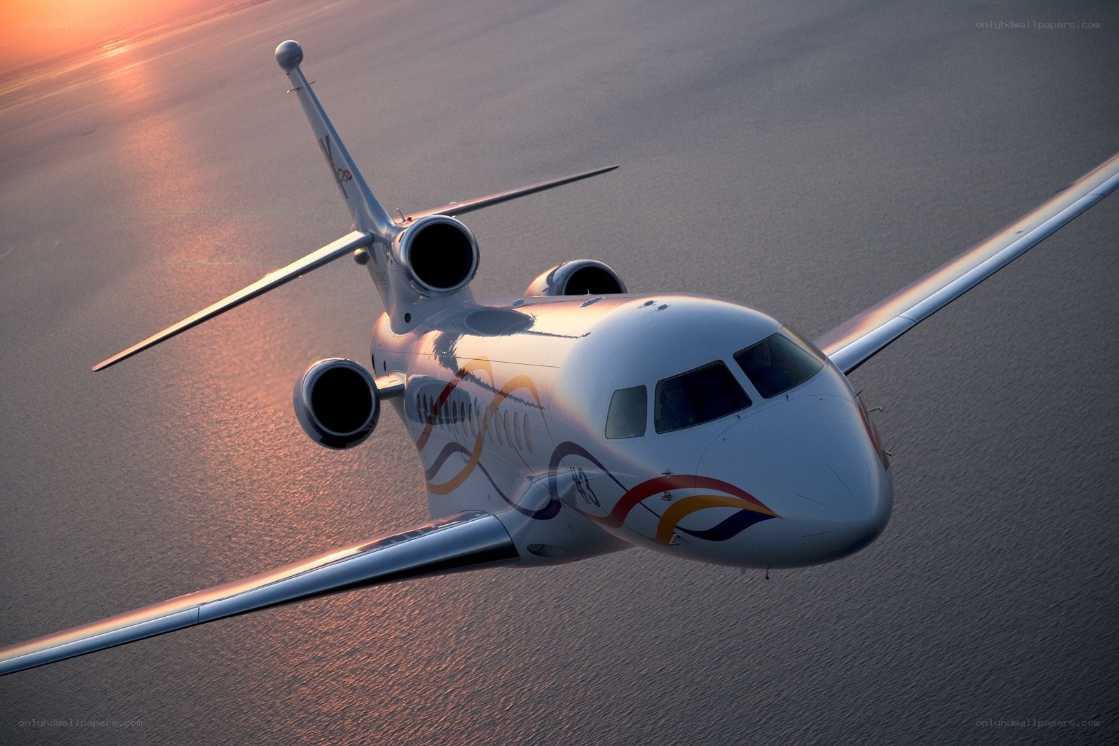 private jet flying over ocean
