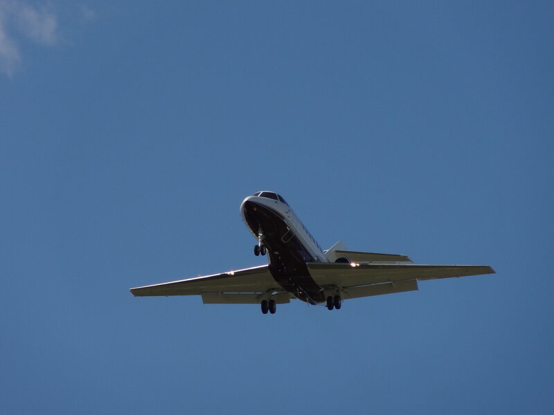Private Jet in Flight — Blue