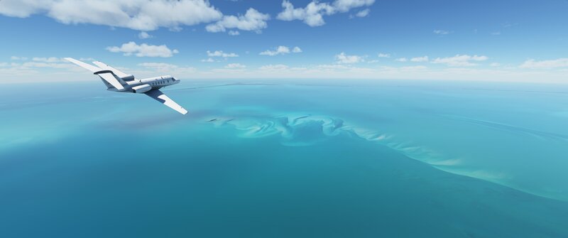 Private Jet over Ocean — Blue