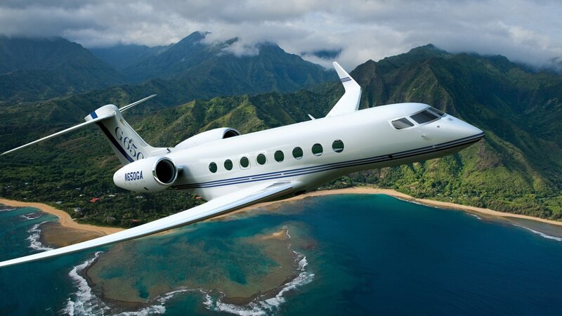 Private jet over tropical island