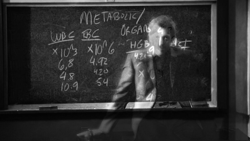 Professor at a chalkboard