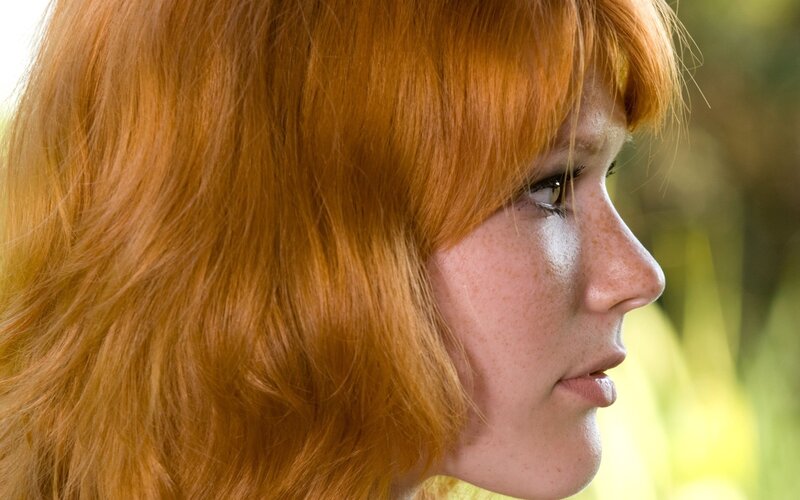 profile of a red-haired woman