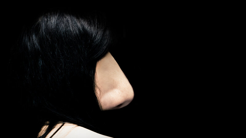 profile of a woman in shadow