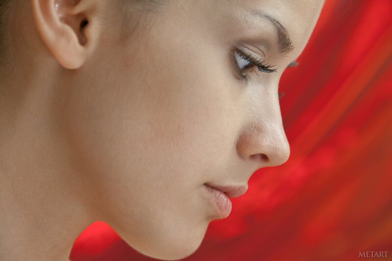 profile of a woman with red background