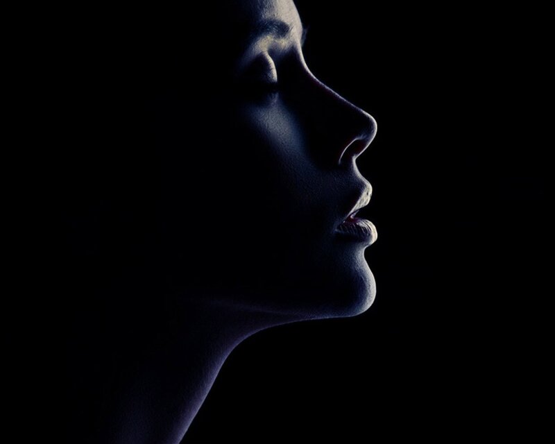 profile silhouette in blue light