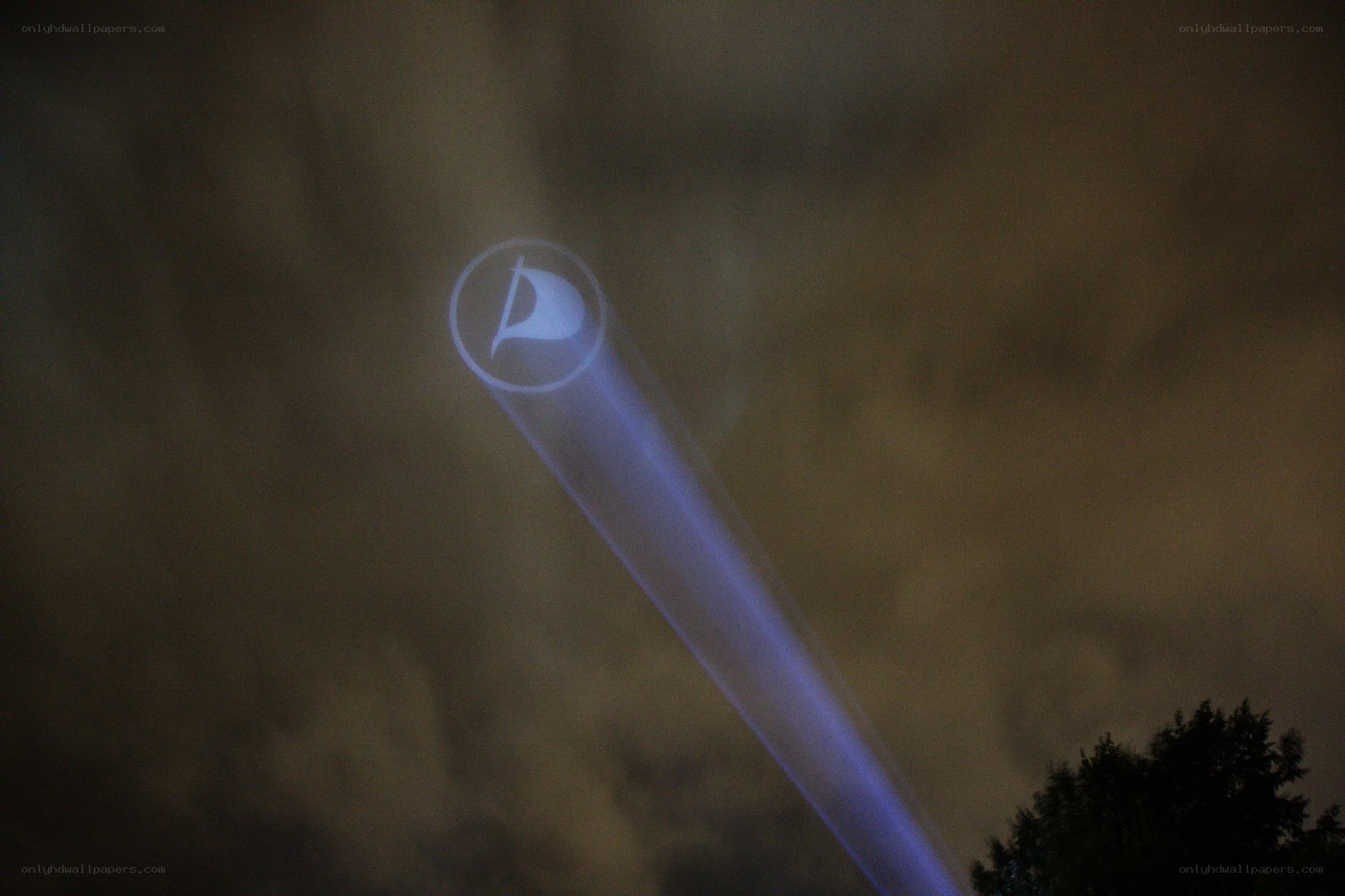 projected logo in night sky