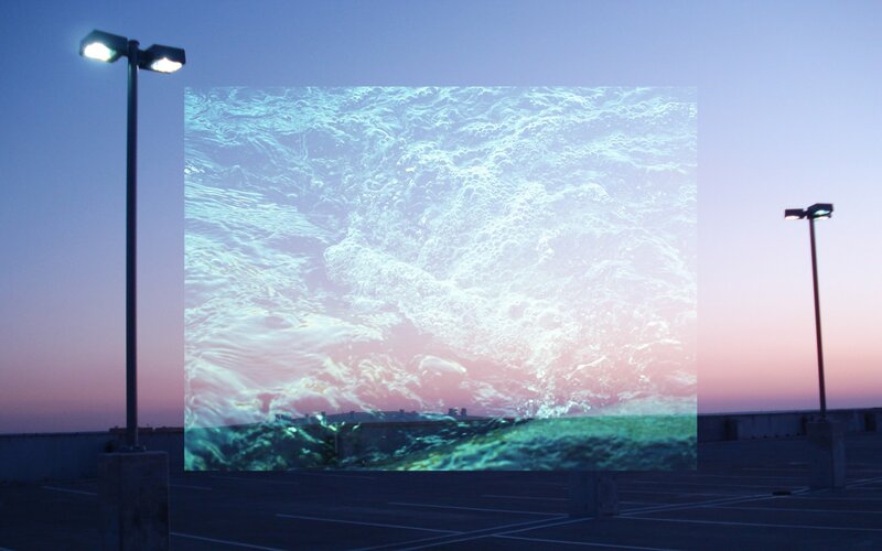 Projection of ocean waves on parking lot