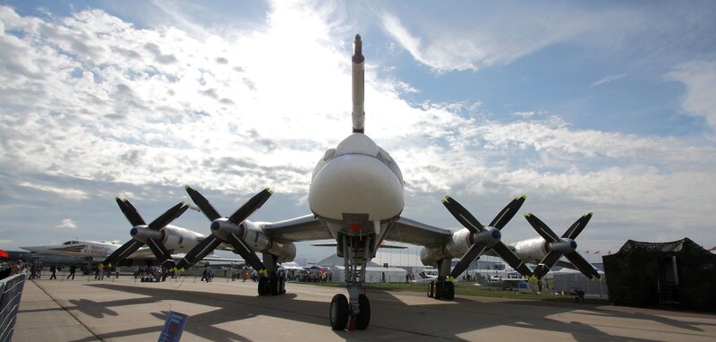 Propeller Aircraft on Tarmac — White