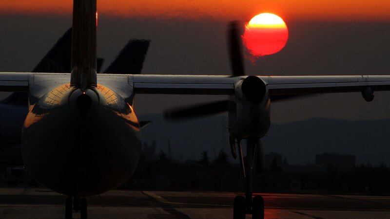Propeller Airplane at Sunset