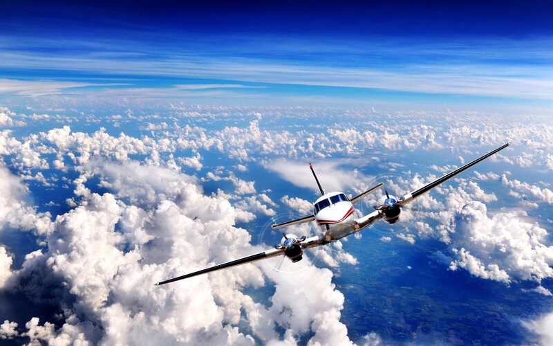 Propeller Airplane Flying — Blue, Serene, Afternoon, Photograph