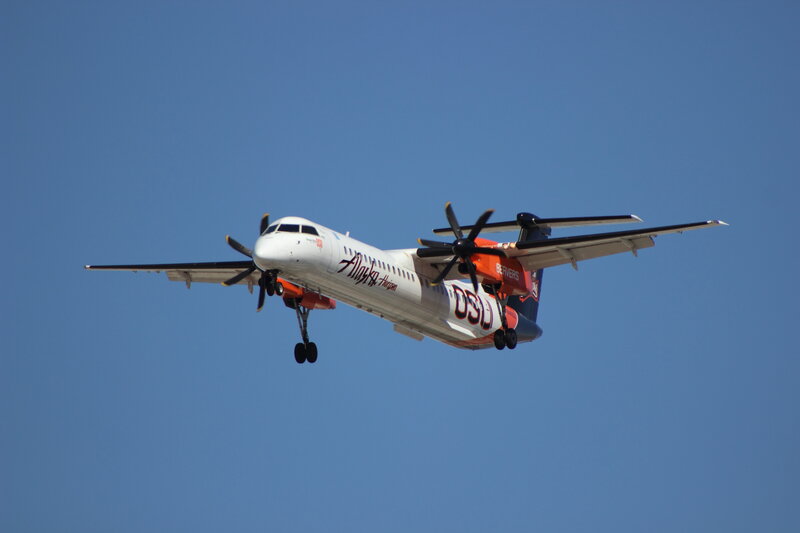 Propeller Airplane in Flight — Blue, Clear