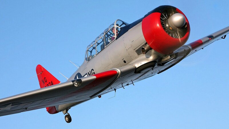Propeller Airplane in Flight — Blue, Dynamic, Afternoon